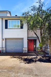 a house with a red door and a garage at HG Coastal in Demere Park
