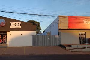 a building with a sign on the side of it at Apartamento Loft 03 Ponta Porã MS. in Ponta Porã