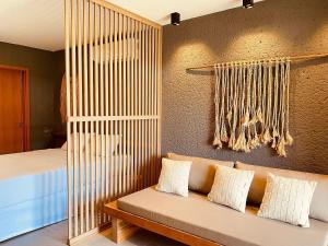 a room with a couch and a bed at Villas Manatee Milagres por Quarto à Vista in Pôrto de Pedras +238 photos