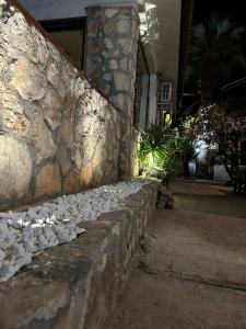 a stone wall with a bunch of rocks on it at Villa "OLD FISHERMAN'S" in Taranto
