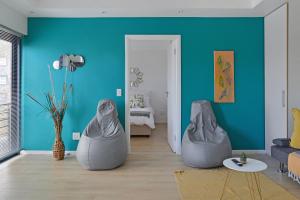 a living room with two bean bags on the floor at 108 Waverley in Cape Town