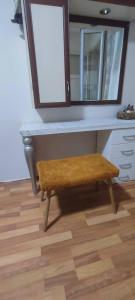 a dressing table with a bench and a mirror at Alsancak Konak seaside 50 mt walk Double room in Konak