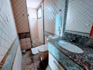 a bathroom with a sink and a toilet at Lets Diária Brasil 64138 in Brasilia