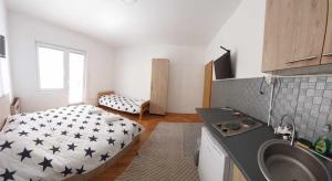 a bedroom with a bed with stars on it at Vila Visni in Ohrid