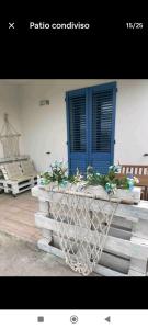 a planter with flowers in it sitting on a bench at B&B Villa Alma in San Cristoforo de Valli