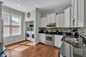 a kitchen with white cabinets and white appliances at Nashville - 931 Russell St Units A & D - COMBO in Nashville