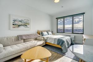 a living room with a couch and a bed at Ski-InandSki-Out Park City Studio Community Hot Tub in Park City