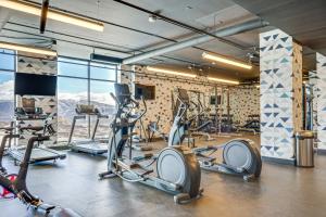 a gym with treadmills and cardio machines in a room at Ski-InandSki-Out Park City Studio Community Hot Tub in Park City