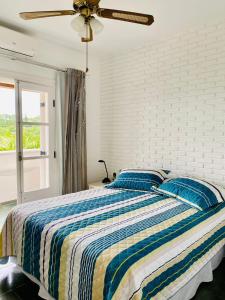 Ένα ή περισσότερα κρεβάτια σε δωμάτιο στο A Casa Flow na Represa