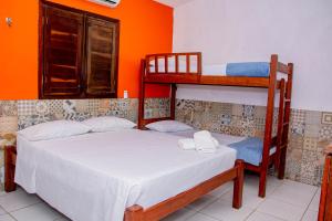 Ένα ή περισσότερα κρεβάτια σε δωμάτιο στο Pousada Flat Castor