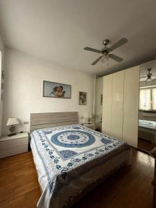 a bedroom with a bed and a ceiling fan at Villa Iris in Casarza Ligure +7 photos