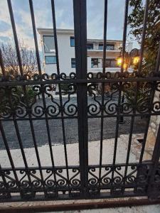 a black iron gate with a street behind it at Vila Romantica in Budva