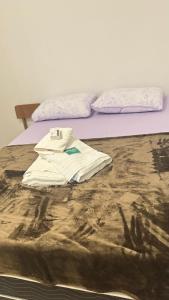 เตียงในห้องที่ Cantinho familiar 200m Hospital Regional