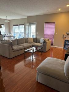a living room with a couch and a table at Condo Townhome - Cleveland Lake Area 