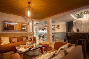 a living room with a couch and a table at LES TANNEURS PENTHOUSE MARRAKECH in Marrakesh