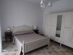 Postel nebo postele na pokoji v ubytování Residenza Regina Margherita, Apud Montes
