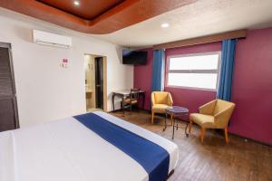 Postel nebo postele na pokoji v ubytování Hotel Rose Ensenada