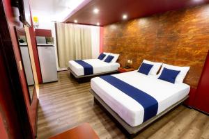 Postel nebo postele na pokoji v ubytování Hotel Rose Ensenada