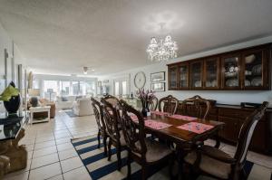 a kitchen and dining room with a table and chairs at Dauphin Island in Forney