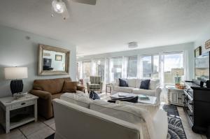 a living room with two couches and a tv at Dauphin Island in Forney