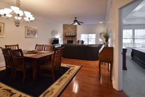 a dining room and living room with a table and chairs at Lakeview Dreams in Young Harris +16 photos