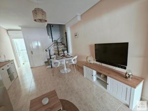 a living room with a large flat screen tv at Casa Miramar in Ciudad Quesada
