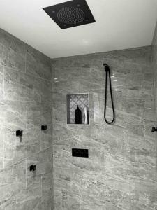 a bathroom with a shower with a shower head at Beautiful Home with Bay View minutes from AC in Pleasantville