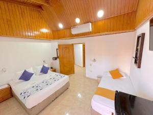 Hotel Grand Caribe客房内的一张或多张床位
