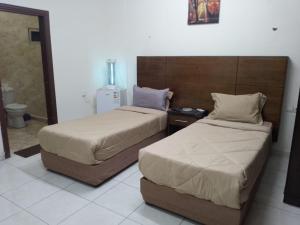 En eller flere senge i et værelse på Amir Palace Hotel