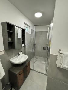 Koupelna v ubytování Aparthotel Infinity + 19 fotografií