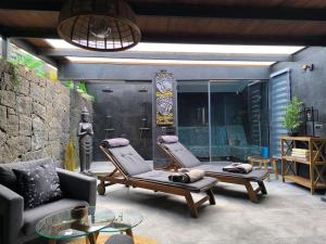 a patio with two lounge chairs and a shower at SPA HOUSE 2 in Tías