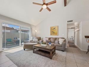 a living room with a couch and a ceiling fan at Lemon Tree #72 Chandler condo in Chandler