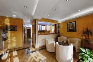 a living room with a counter and a kitchen at Apartments Ivona in Budva