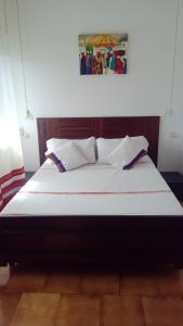 a large bed in a room with at Moifaka Studio Hotel in Moroni