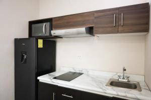 Kuchyň nebo kuchyňský kout v ubytování Aura Hotel B&B