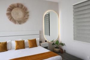 Postel nebo postele na pokoji v ubytování Aura Hotel B&B