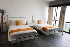 Postel nebo postele na pokoji v ubytování Aura Hotel B&B