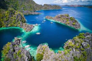 an aerial view of a bay with boats in the water at Rovi Homestay in Coron