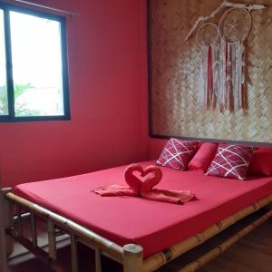Postel nebo postele na pokoji v ubytování Rovi Homestay
