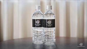 a bottle of water sitting on top of a table at Daiwa Roynet Hotel Hachinohe in Hachinohe