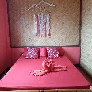 Postel nebo postele na pokoji v ubytování Rovi Homestay