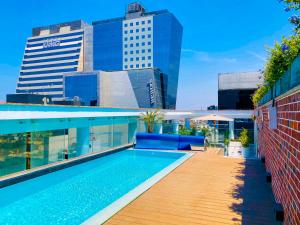 a swimming pool on the roof of a building at Casa Andina Premium San Isidro in Lima