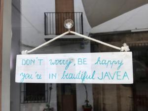 a sign that says dont worry be happy you are in beautifulzona at Casita Bonita - with private garden near beach in Jávea in Jávea
