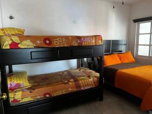 Postel nebo postele na pokoji v ubytování Casa La Tabasqueña + 37 fotografií