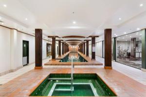 a lobby with a pool in the middle of a building at Inner City Retreat 1BD Pyrmont - 302 in Sydney