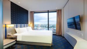 Holiday Inn Express Singapore Katong by IHG客房内的一张或多张床位