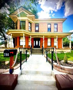 a large orange house with a gate in front of it at The Casita in Raton