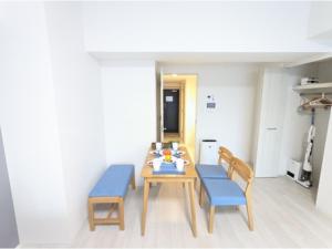 a dining room with a table and two chairs at Eslead Hotel Osaka Tsuruhashi - Vacation STAY 77569v in Osaka