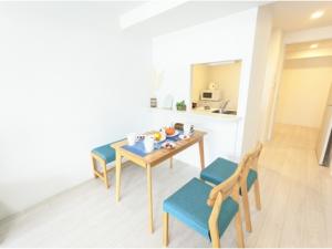 a dining room with a table and two chairs at Eslead Hotel Osaka Tsuruhashi - Vacation STAY 77723v in Osaka