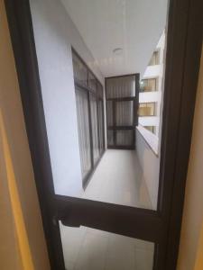 a view through a door of a room with a window at Alsam Real Estate Gust House in Addis Ababa